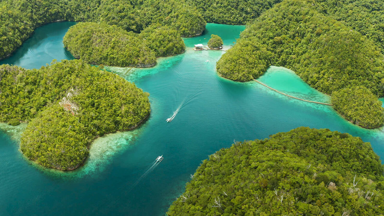 Overhead view of pristine waters, islands, dwellings right on the water